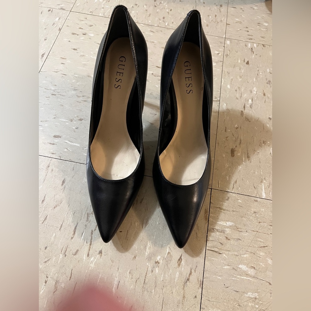 Black Guess heels, size 7 1/2 never worn. Leopard print on heel.